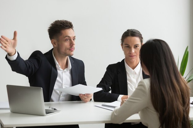 Male HR manager asking job candidate to leave