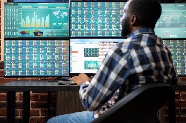 Male investor tracking stock market data