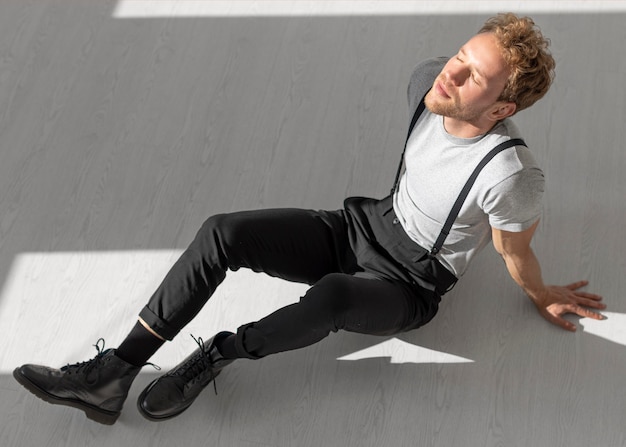 Male model sitting on the floor high view