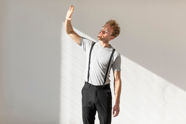 Male model standing in daylight