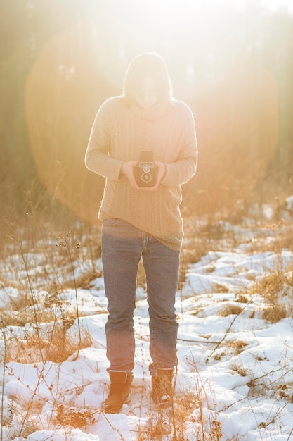 Free photo male model using a retro camera