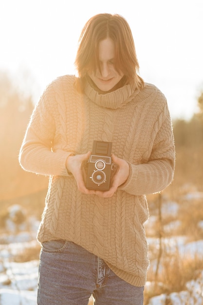 Free photo male model using a retro camera