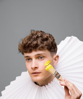 male model with illuminating paint on his face