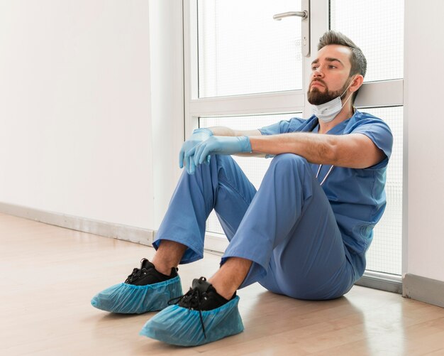 Male nurse tired after a long day at work