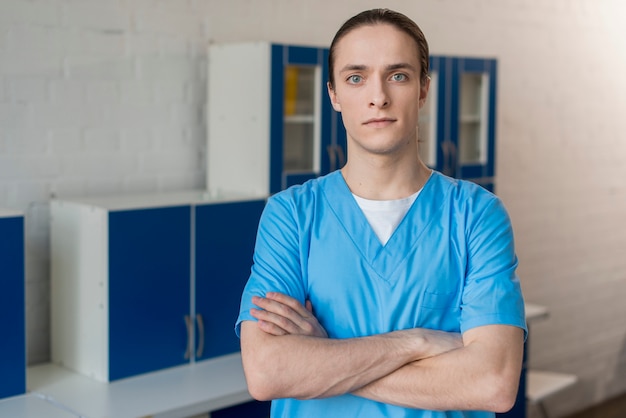 Male nurse with arms crossed