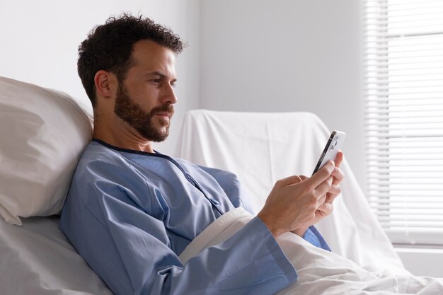 Male patient in bed at the hospital