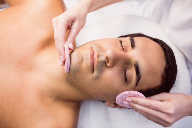 Male patient receiving massage from doctor