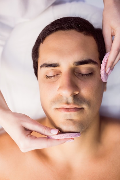 Male patient receiving massage from doctor