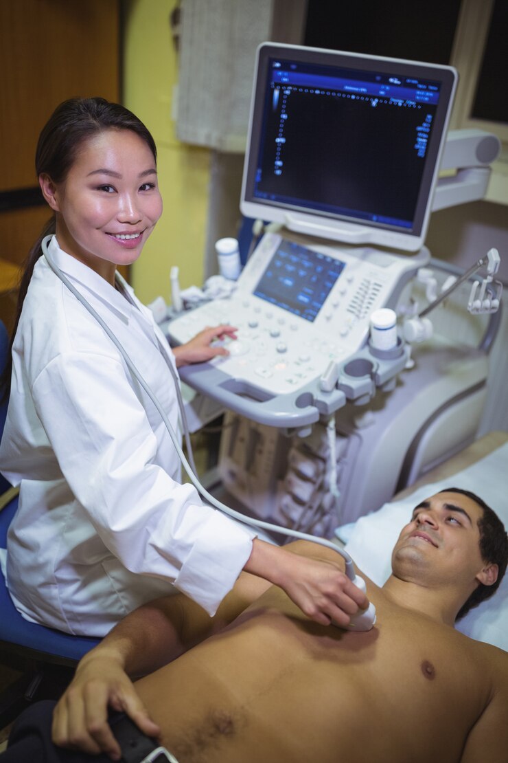Free Photo male patient receiving a ultrasound scan on the chest