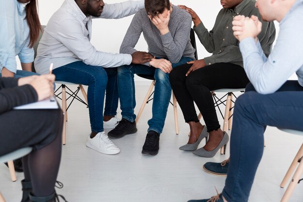 Free Photo male patients consoling sad man