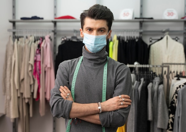 Male personal shopper with mask working