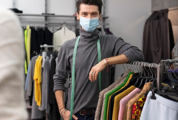 Male personal shopper with mask working