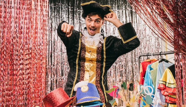 Male in pirate costume pointing