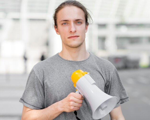 Male protester holding a megaphone