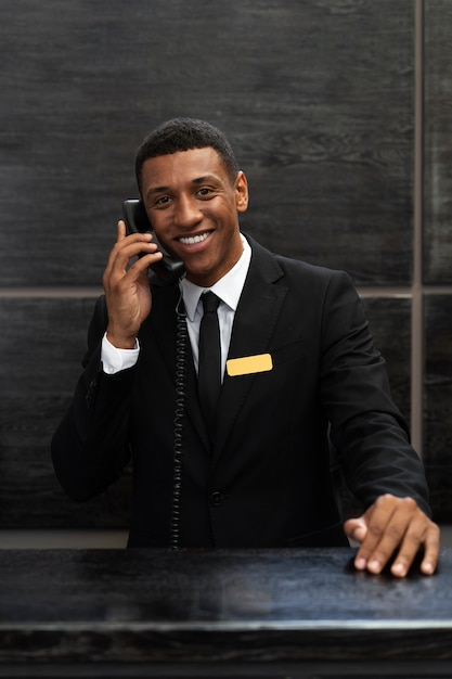 Male receptionist in elegant suit during work hours