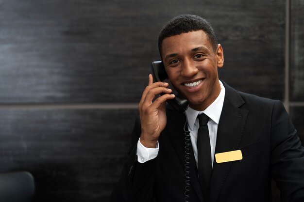 Male receptionist in elegant suit during work hours