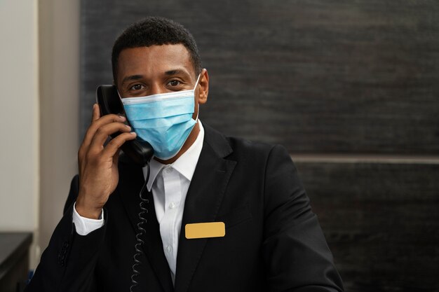 Male receptionist in elegant suit during work hours