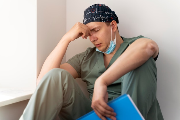 Male student practicing medicine