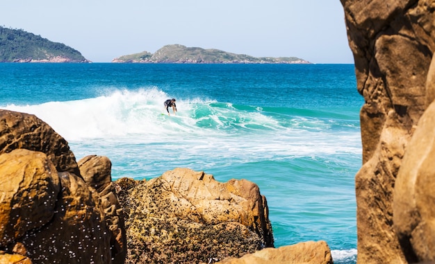 Male surfer in a wavy sea