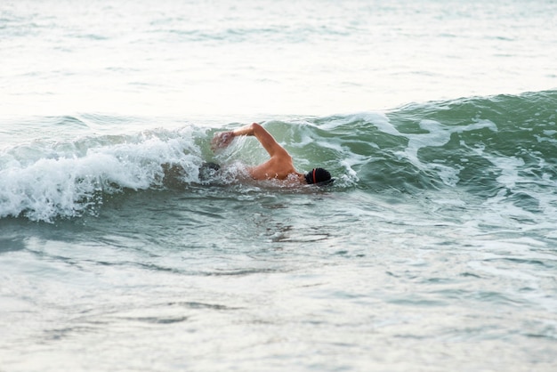 Male swimmer swimming in the ocean