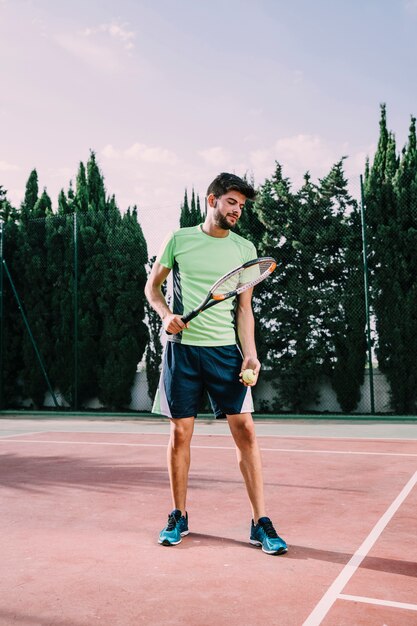 Male tennis player serving