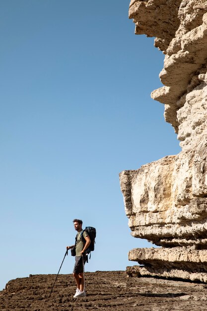 Male traveler ready to hike in daylight