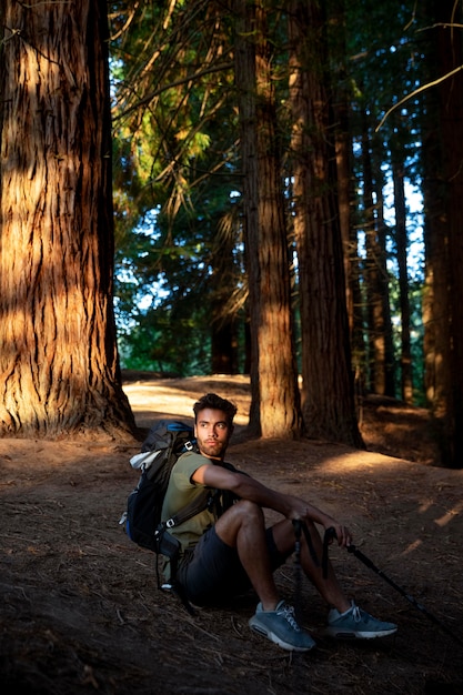 Male traveler relaxing in the forest