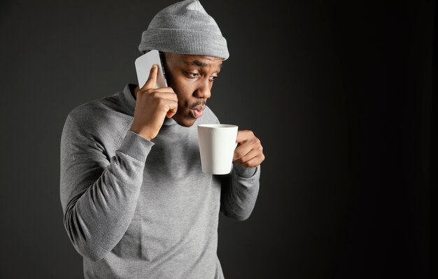 Male wearing cap talking on phone