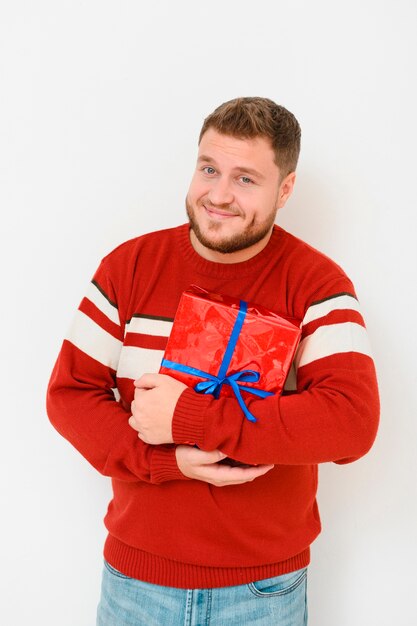 Male winter model holding the gift