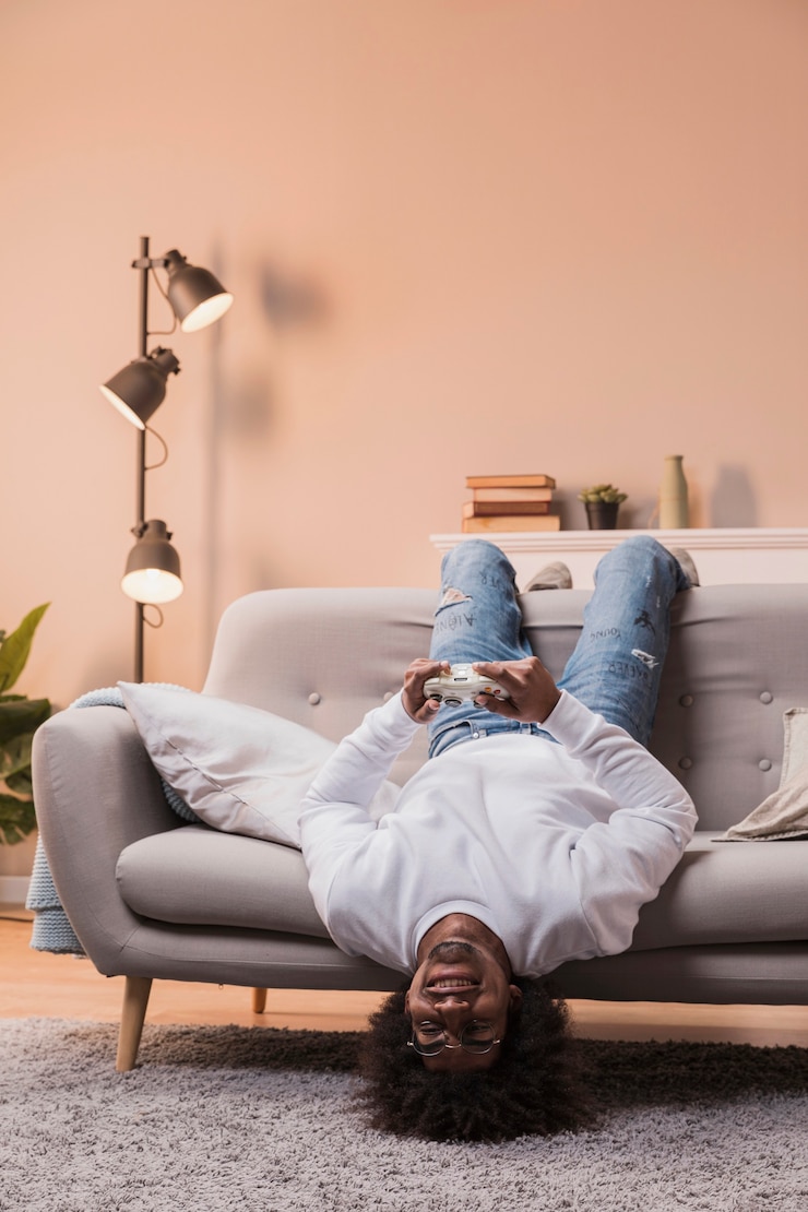Free Photo male with head upside down playing game