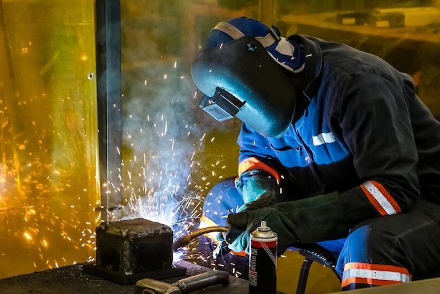 Male working with a welding torch