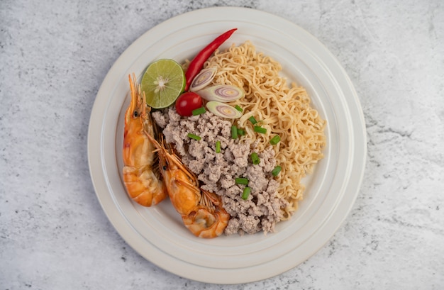 Mama and shrimp on a white plate.