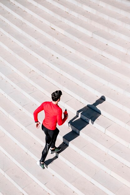 Man actively running upstairs