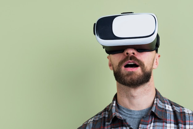 Man amazed by virtual reality glasses