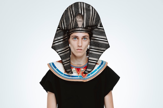 Free photo man in ancient egyptian costume with serious confident expression on white