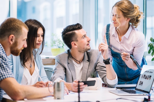 Man asking colleagues for advice