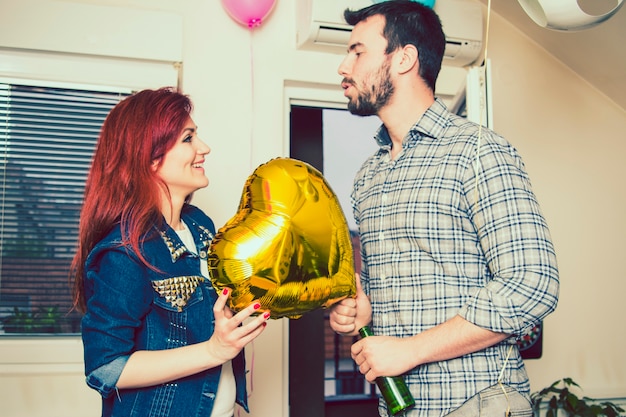 Free photo man asking his girlfriend for a kiss