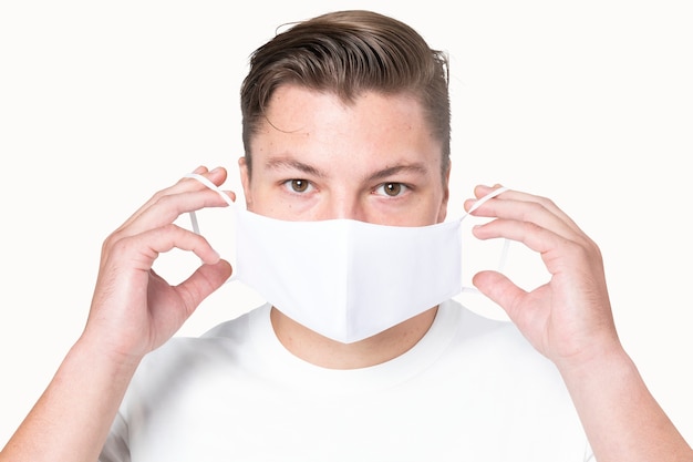 Man in basic white mask  for COVID-19 protection campaign