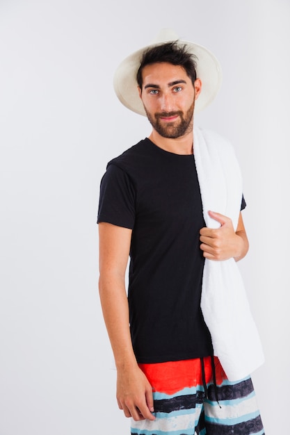 Man in beachwear with towel close up