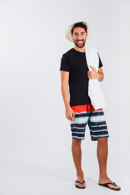 Man in beachwear with towel