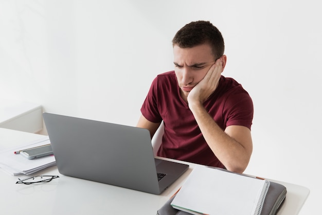 Man being bored at his office space