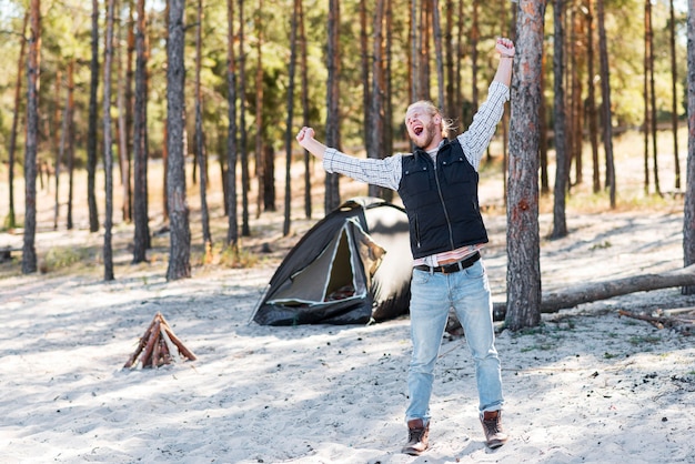 Man being extremely happy in the wilderness