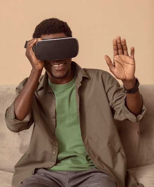 Free photo man being happy about using the vr headset