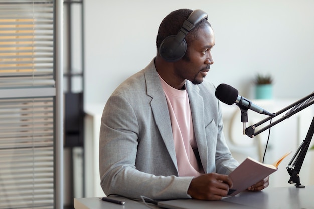 Free photo man being interviewed in a podcast