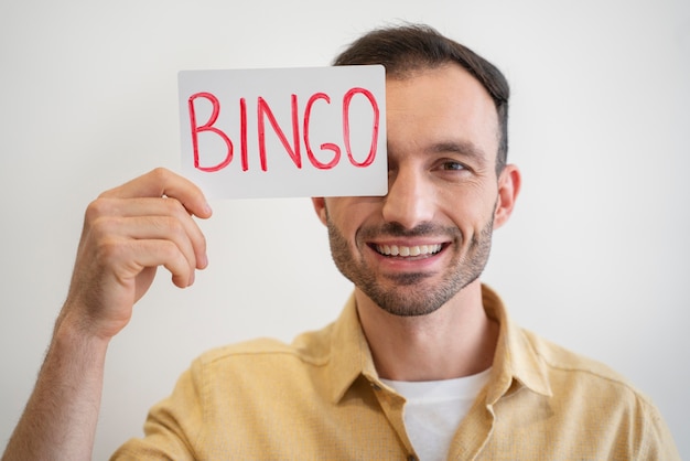 Free photo man being passionate about playing bingo