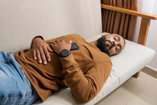man being tired after spending too much time on his phone