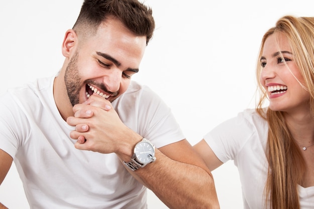 Man biting woman and laughing