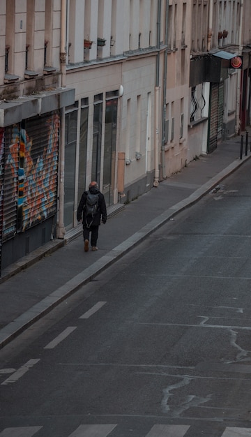 Free Stock Photo: Man in Black Coat Walking on Sidewalk