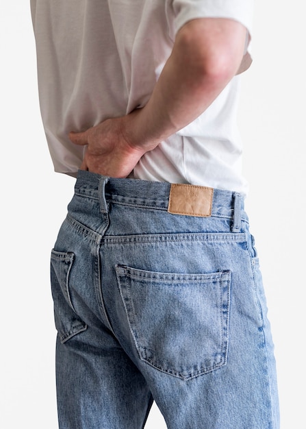 Man in blue jeans with tag