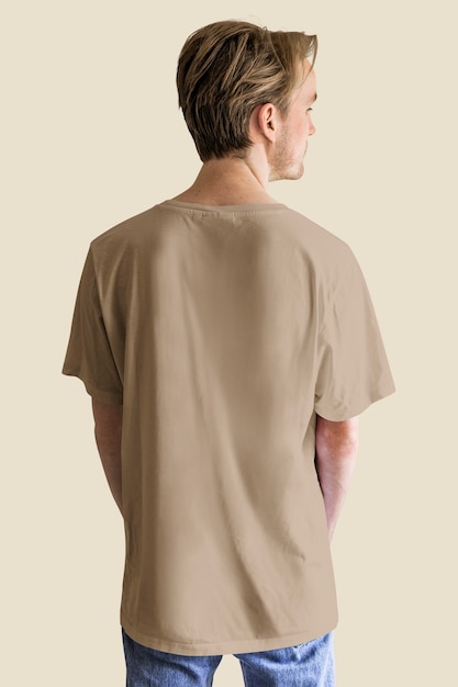 Man in brown blue jeans t-shirt